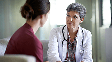 Female doctor and female patient talking