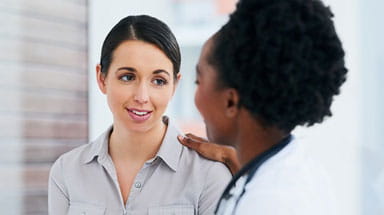 Doctor consulting breast cancer patient
