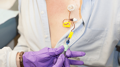 Administering chemotherapy on a patient's chest
