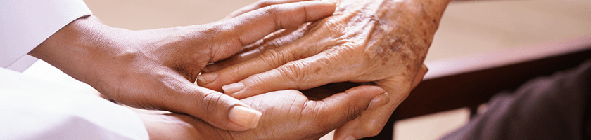 Two women holding hands