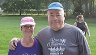 Image of Lew and his wife at race.