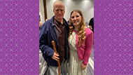 Image of Robert Stanfod and his granddaughter, standing at an event. 