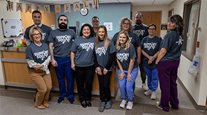 A group photo where everyone is wearing #RyanStrong t-shirts in support.