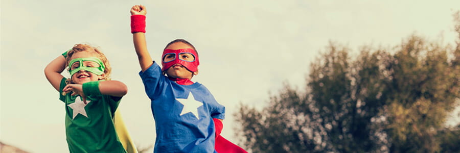 Two kids dressed up as superheroes