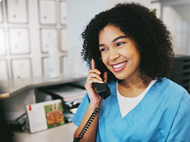 Woman at a desk on the phone
