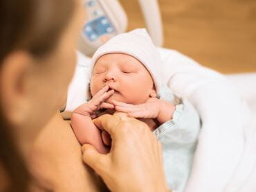 Mom holding new born baby