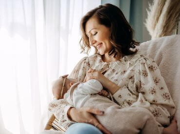 Mom and dad holding a baby