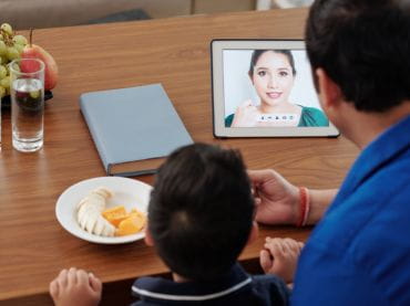 Dad and child at a video visit