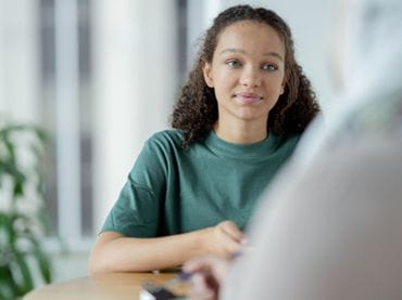Teen girl in a green shirt