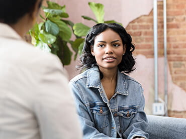 Adult talking to a teen