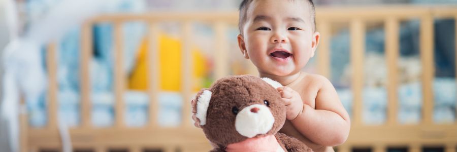 Baby holding a teddy bear