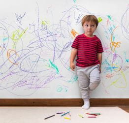 Boy scribbled on a wall