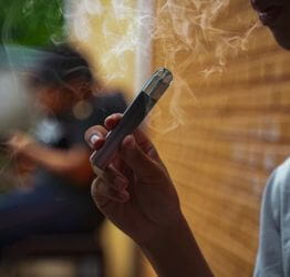 Person smoking a vape pen