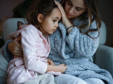 Mother comforting child