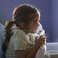 Young girl receiving breathing treatment