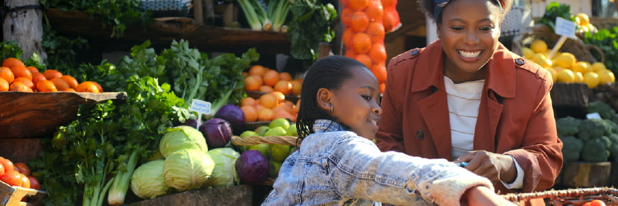 Mom and child shopping in the produce section