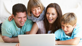 Family looking at a laptop