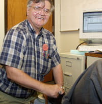 Albert Lexie gives shoe shining tips to Children's