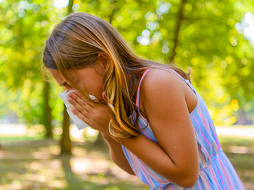 Older teen sneezing