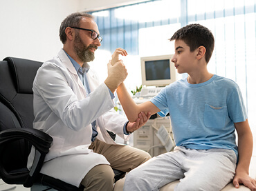 Doctor examining an older child