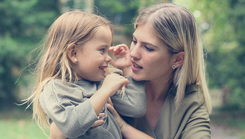 Mother comforting daughter