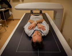 Justin getting a bone mineral density test, also known as a DEXA scan