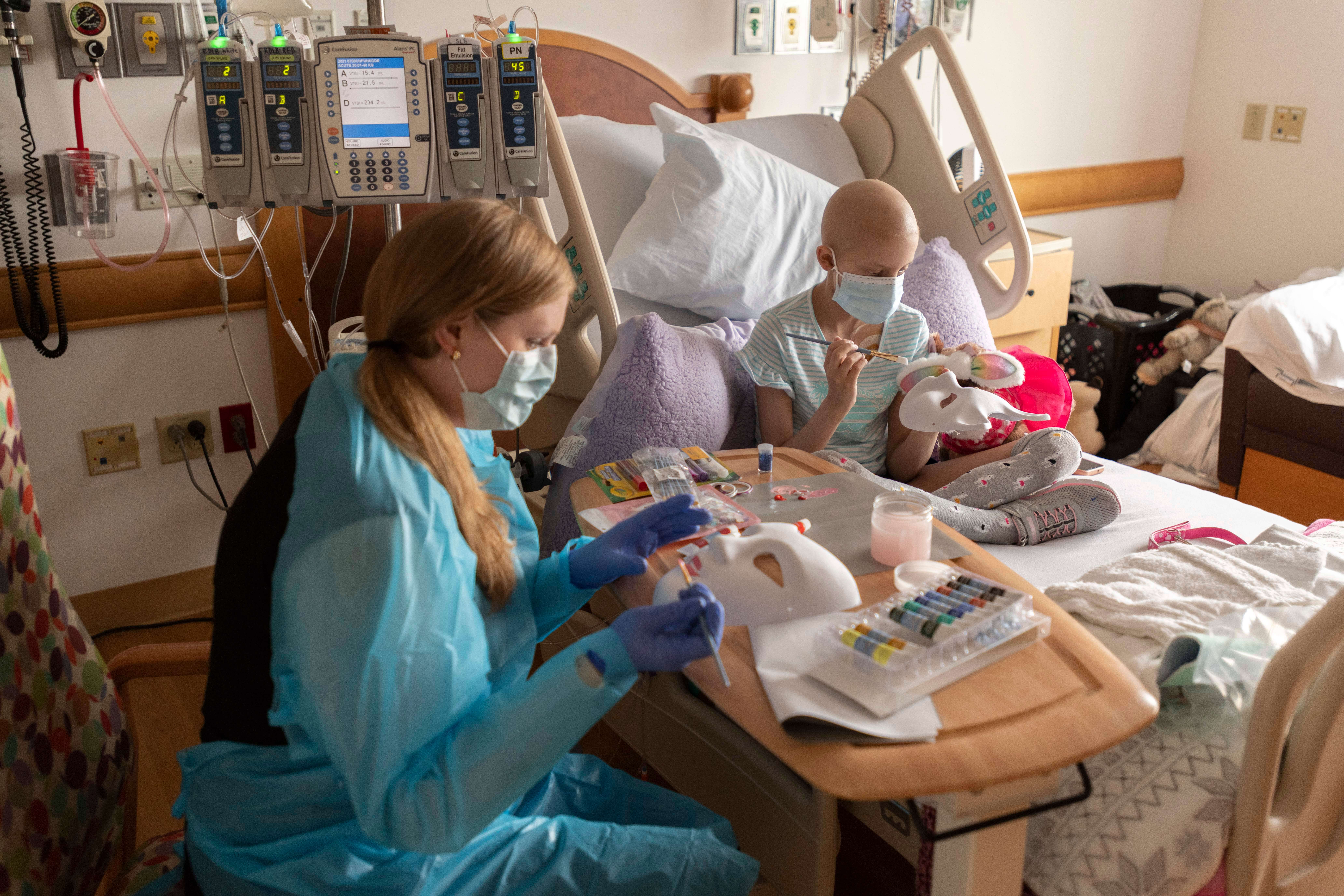 Art therapy being done in a hospital bed.