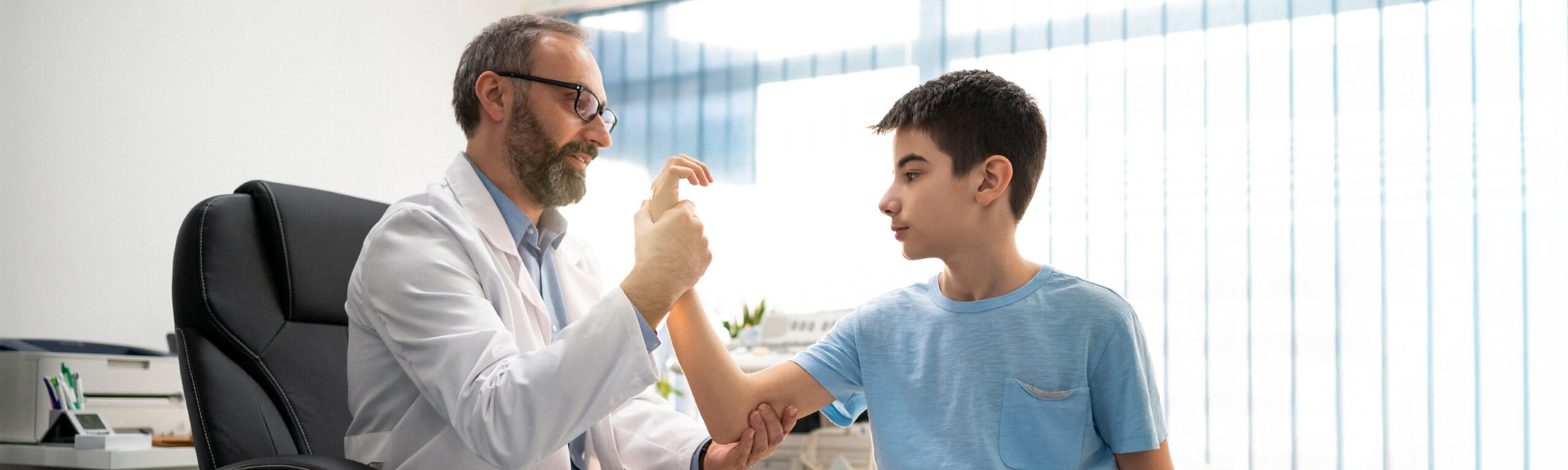 Doctor checking out a patients arm