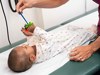 Baby getting checked out by a doctor