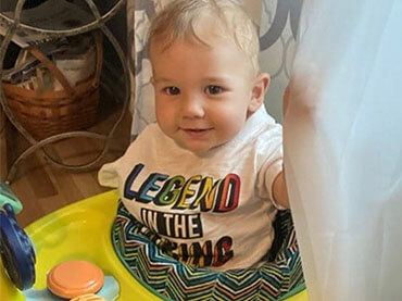 Baby in a t-shirt that says "LEGEND IN THE MAKING"