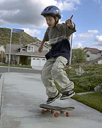 Middle schooler skateboarding