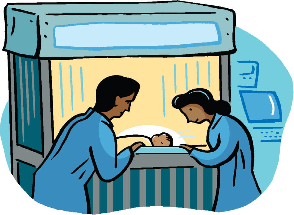 Two doctors review notes at a desk.