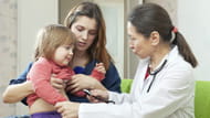 Doctor with mom and girl