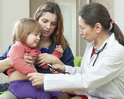 Doctor with mom and girl