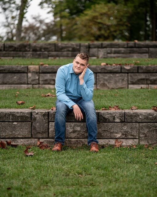 Cal sitting on grassy area
