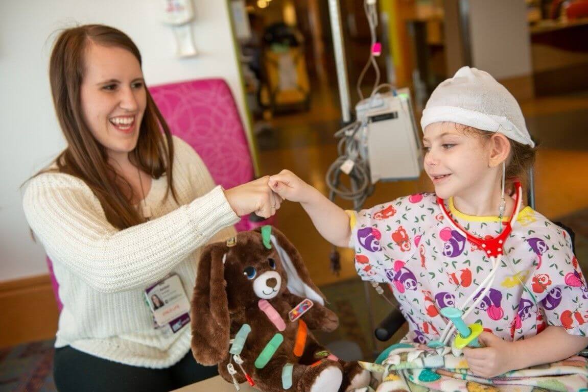 Ella Weisbord in the hospital with her stuffed bear