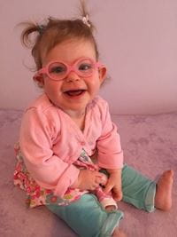 Ella Weisbord as a baby wearing her glasses