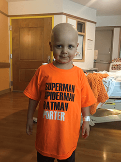 Porter wearing a shirt that says "SUPERMAN, SPIDERMAN, BATMAN, PORTER"