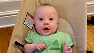 Felicity, a baby in a green onesie