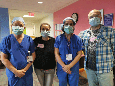 Image of patient's parents with Dr. Da Silva.