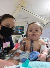 Baby Matthias in the hospital with a nurse.