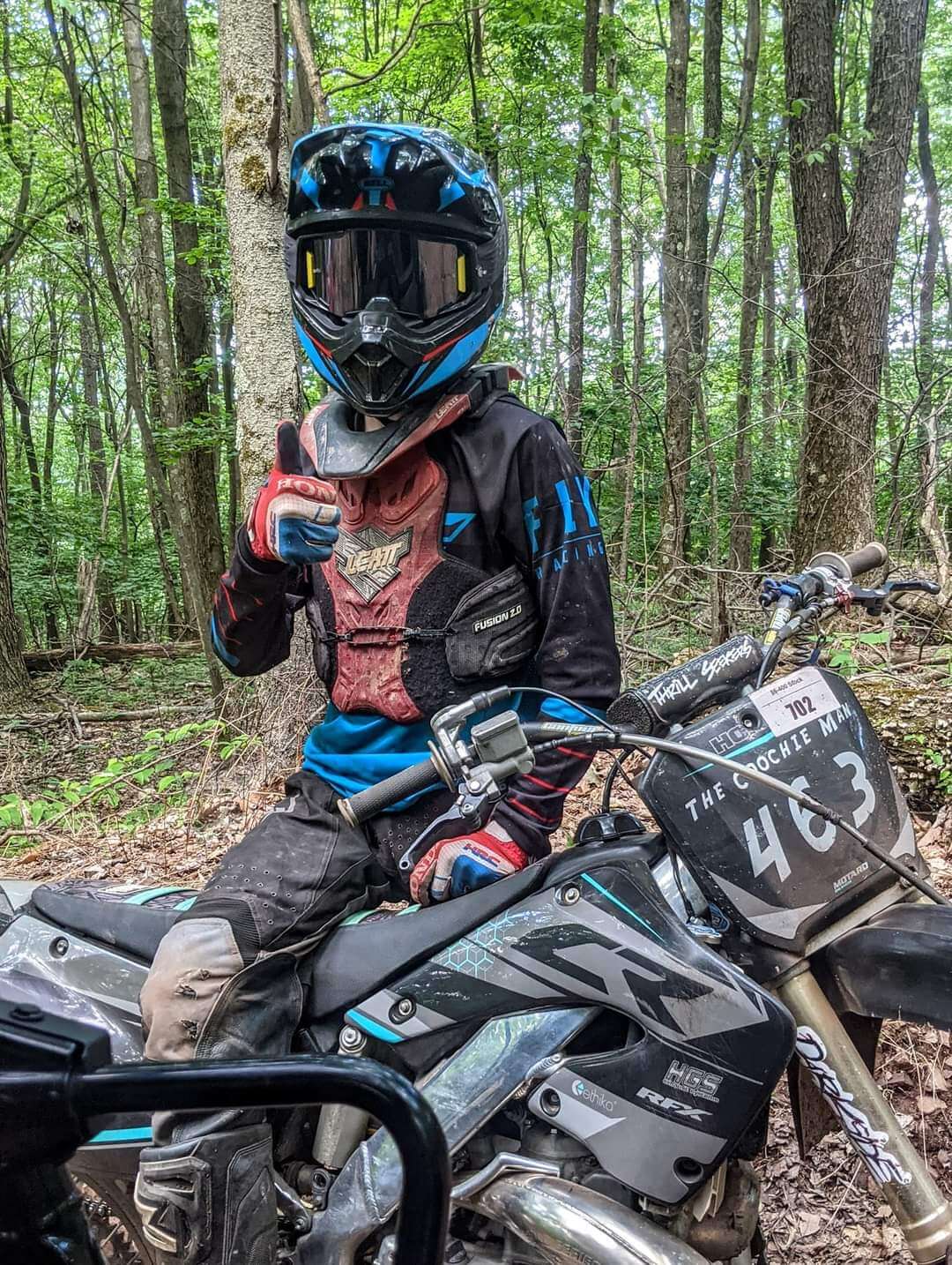 Logan sitting on a bike