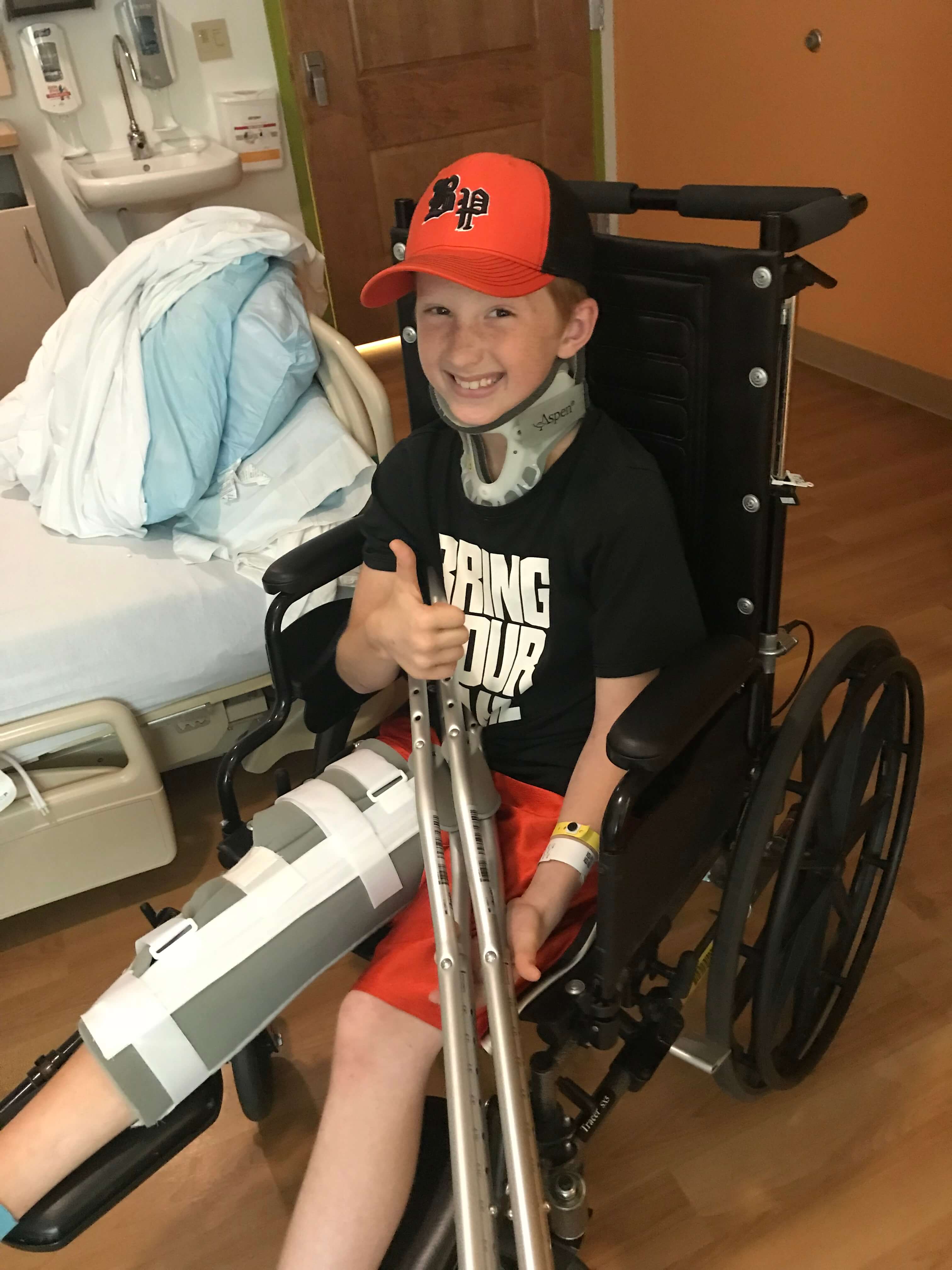 Zach in a wheelchair