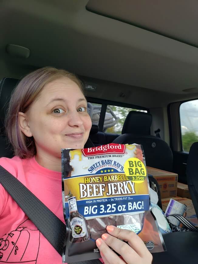 Mindy Nicholas holding beef jerky