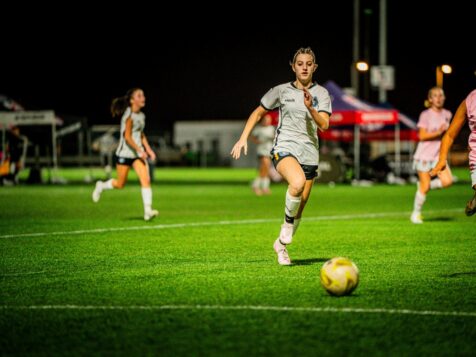 Emma playing soccer