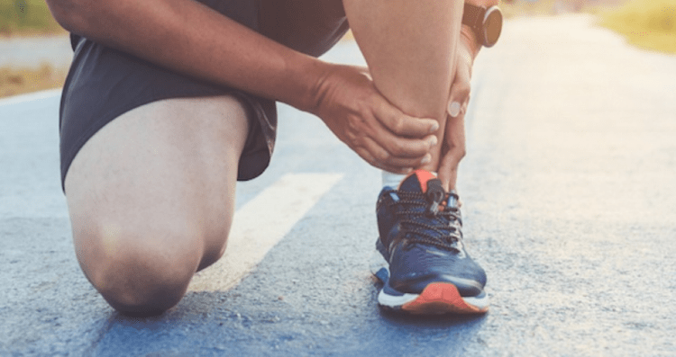 runner holding ankle