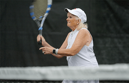 Image of woman playing tennis.