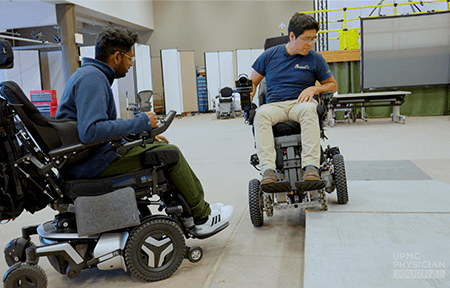 Image of two men in wheelchairs.