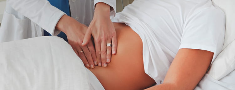 gastroenterology photo of a physician examining patient's abdomen