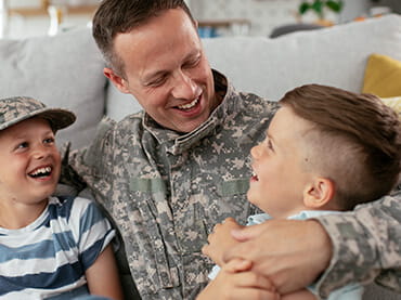 Image of veteran with his kids.